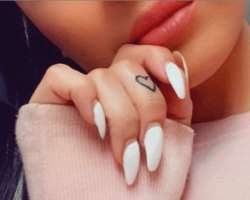 Crystal has a small tattoo on her finger.